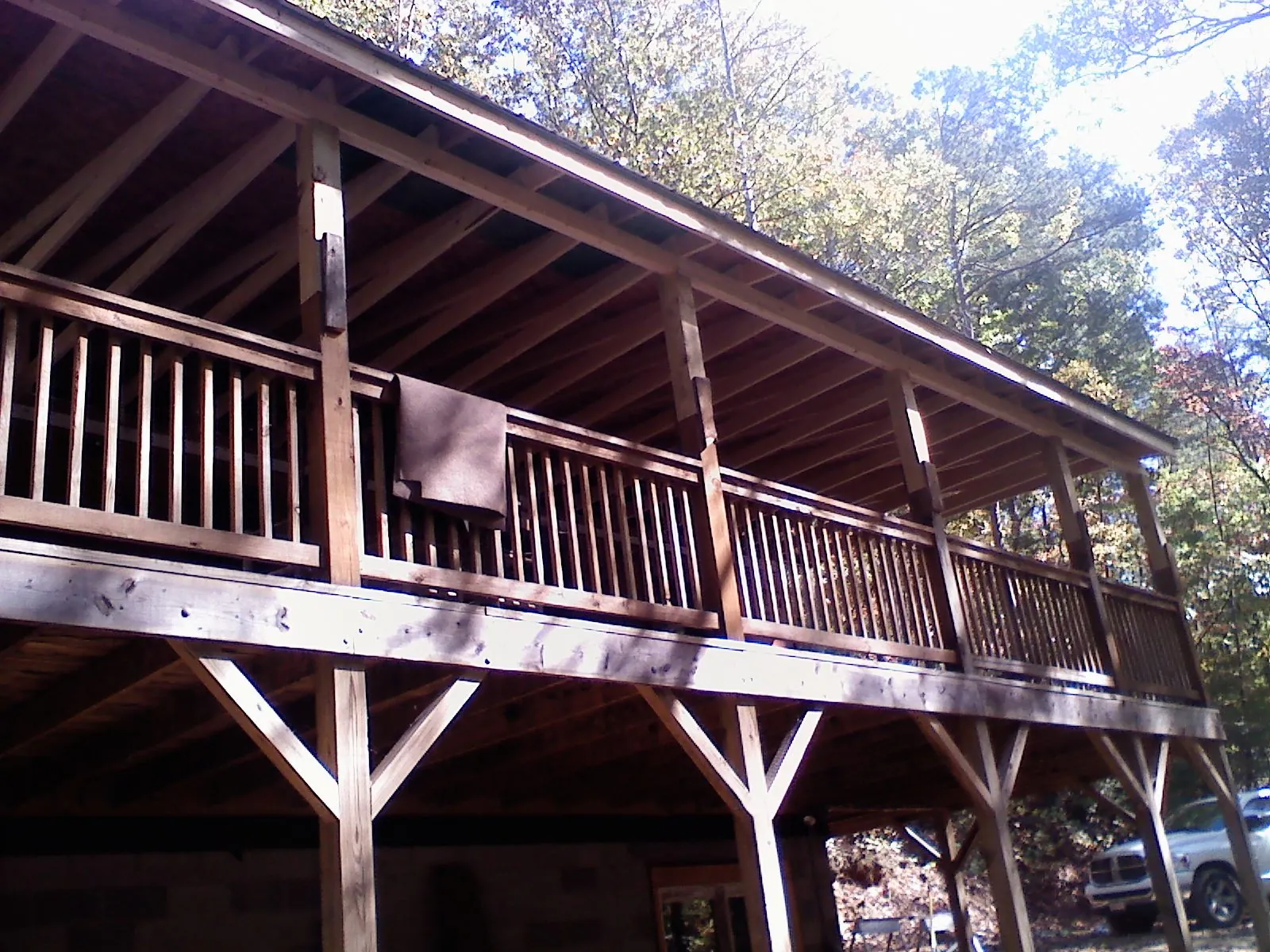 Timber framing under a new elevated porch and deck — Roof Leak Repair in Neihart by Roofing Brothers